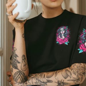 JUST A WOMAN WHO LOVES SKULLS AND HAS TATTOOS ALL OVER PRINT T SHIRT